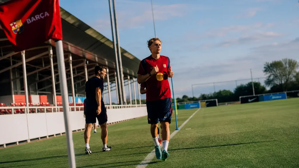 Fermín López jogging during Barcelona's pre-season training session as the Spanish midfielder continues his comeback from injury ahead of the 2026–27 season.