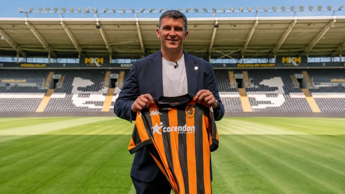 Hull City manager Sergej Jakirovic holding the club shirt at MKM Stadium ahead of the 2026/27 Premier League season amid ongoing summer transfer activity.
