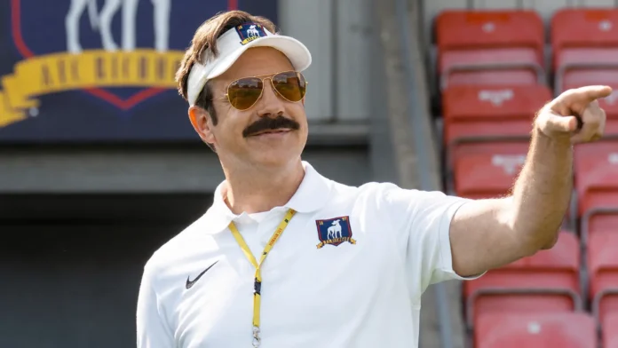 Ted Lasso, played by Jason Sudeikis, wearing AFC Richmond coaching gear during Season 4 of the Apple TV+ football comedy series.